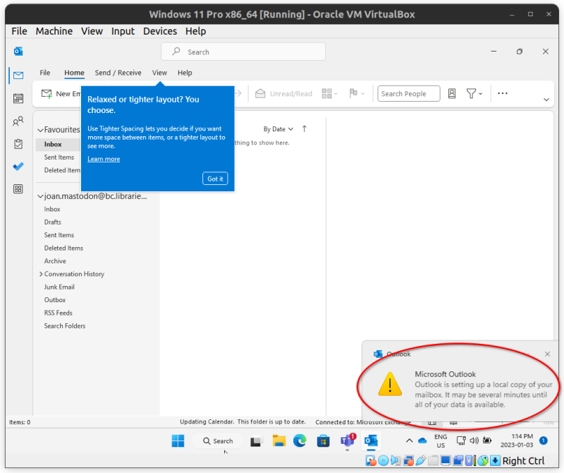 The Microsoft Outlook main screen, including a blue tutorial dialogue and a notification reading "Microsoft Outlook: Outlook is setting up a local copy of your mailbox. It may be several minutes until all of your data is available."